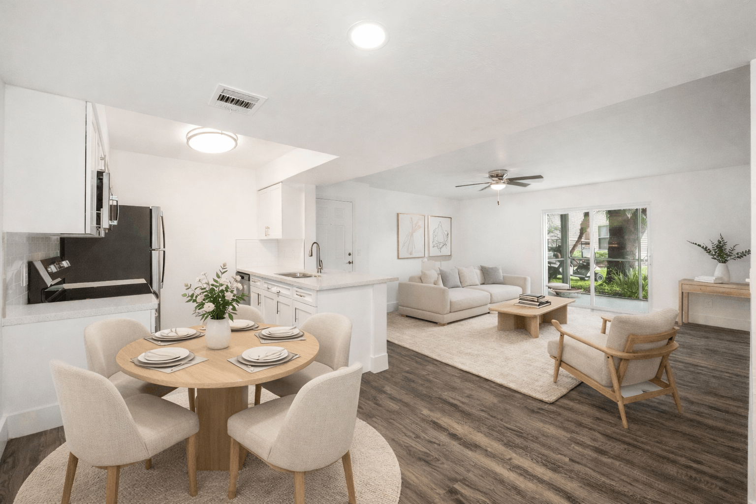 A modern dining room with a wooden table and chairs.
